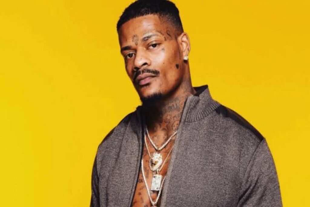 Jason Luv appears in a relaxed and confident setting, reflecting a glimpse into his personal life beyond his public career.